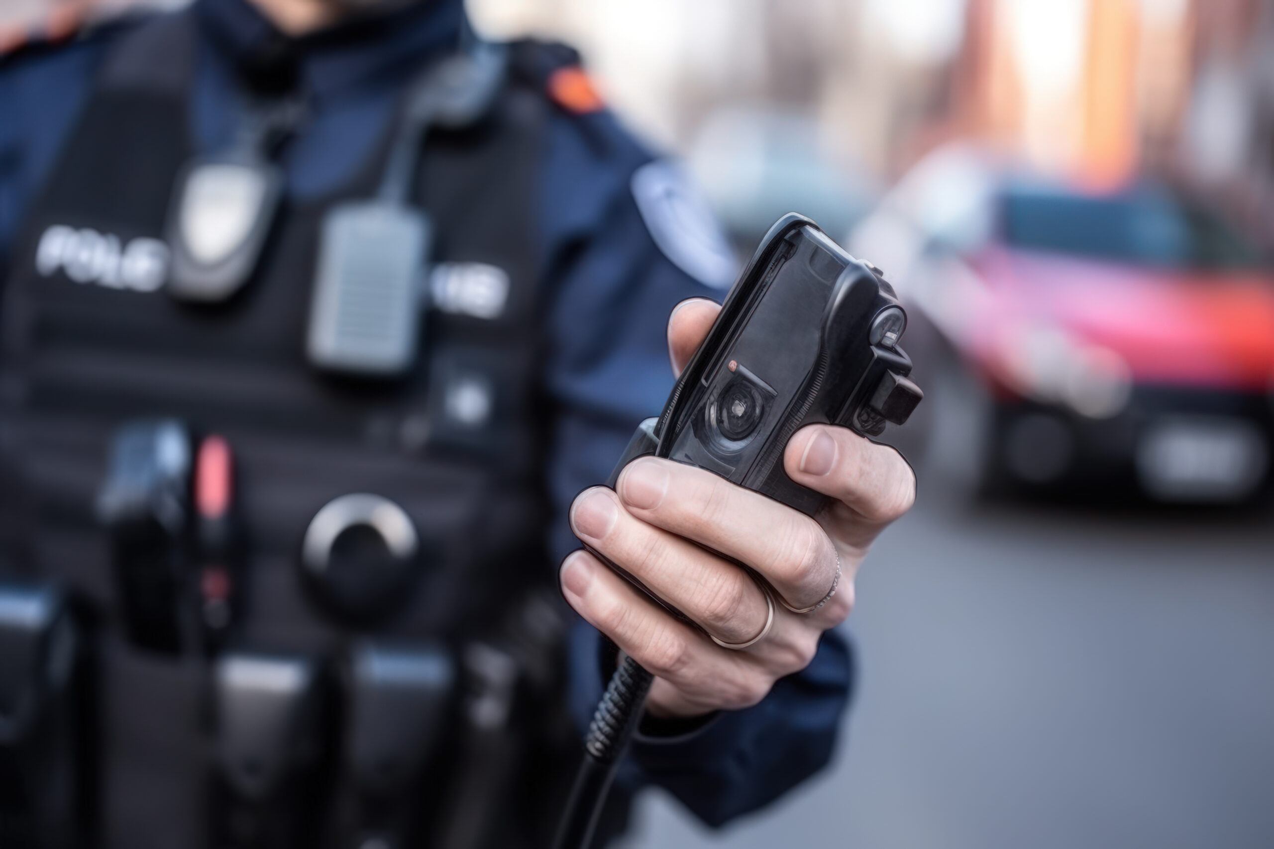 policeman holding body cam