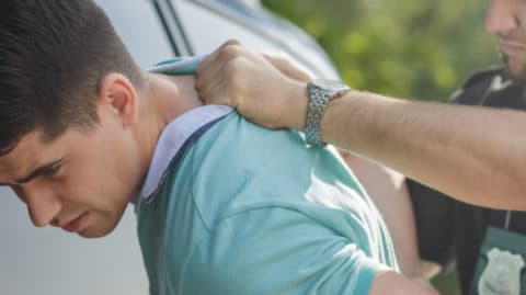 Teenager being arrested