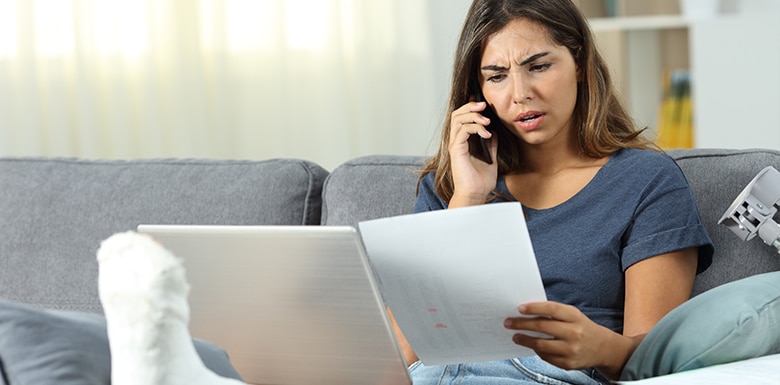 Woman with broken leg on phone