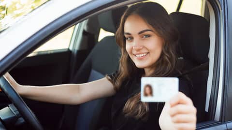 Young woman with driver's license