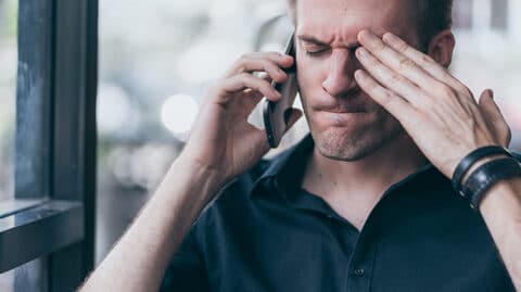 Angry man yelling on phone call