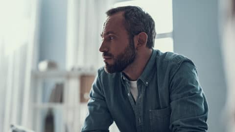 Worried man staring off into space