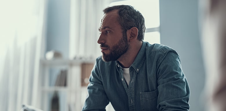 Worried man staring off into space