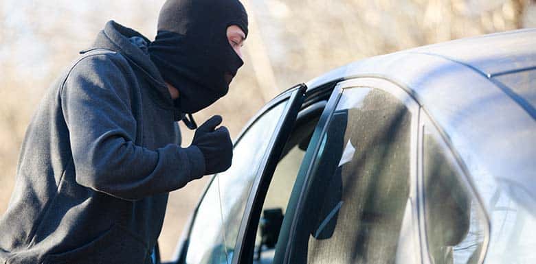 Man breaking into a car