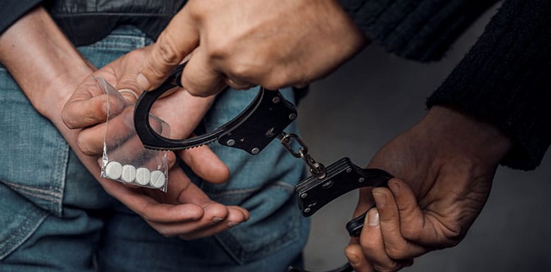 Man being handcuffed because of drug possession in Cincinnati, Ohio